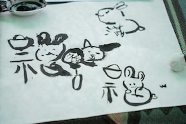 Two squiggles on a dirty piece of paper.